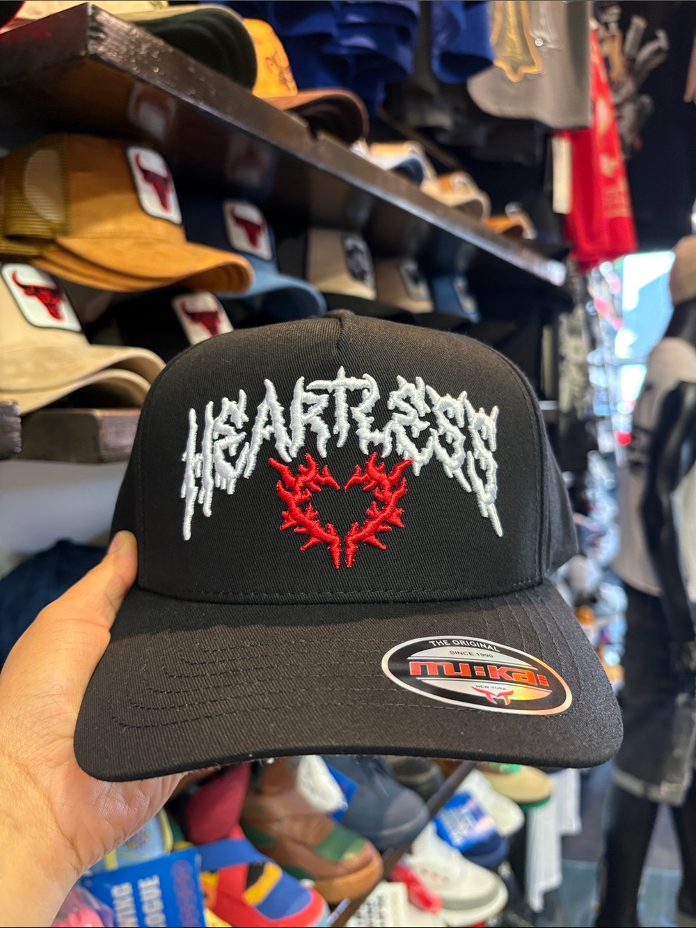 Black 'Heartless' Embroidered Trucker Hat with Red Heart